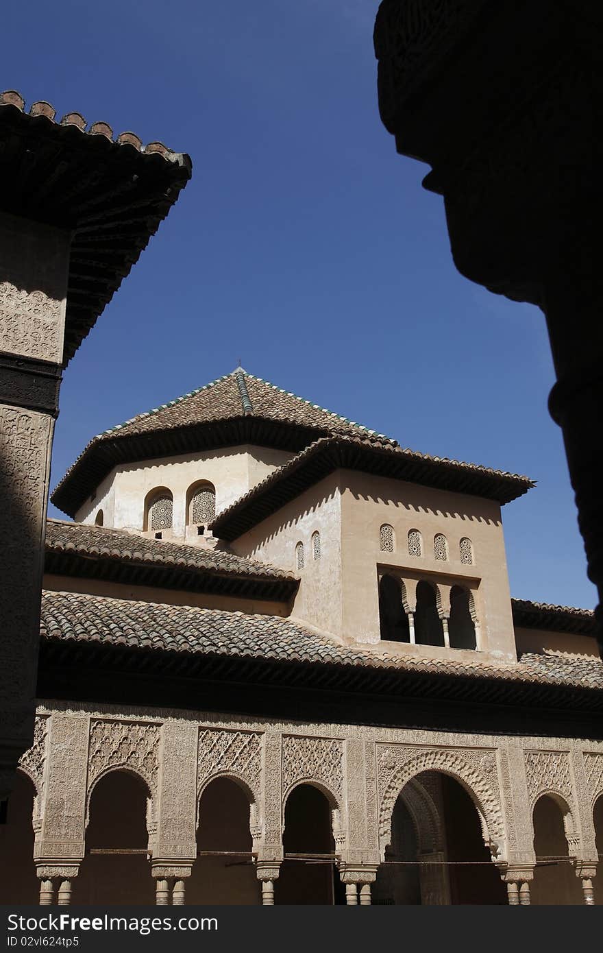 The detail of one of the Alhambra palaces. Alhambra  is a palace and fortress complex constructed during the mid 14th century by the Moorish rulers of the Emirate of Granada in Al-Andalus. The detail of one of the Alhambra palaces. Alhambra  is a palace and fortress complex constructed during the mid 14th century by the Moorish rulers of the Emirate of Granada in Al-Andalus.