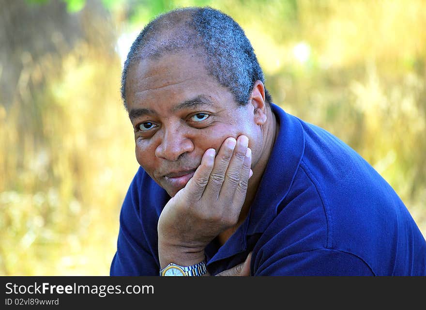 Expressions of an african american male relaxing outdoors. Expressions of an african american male relaxing outdoors.