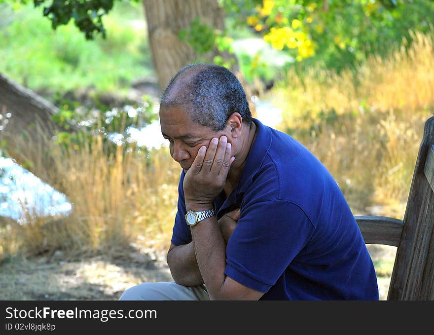 Expressions of an african american male relaxing outdoors. Expressions of an african american male relaxing outdoors.