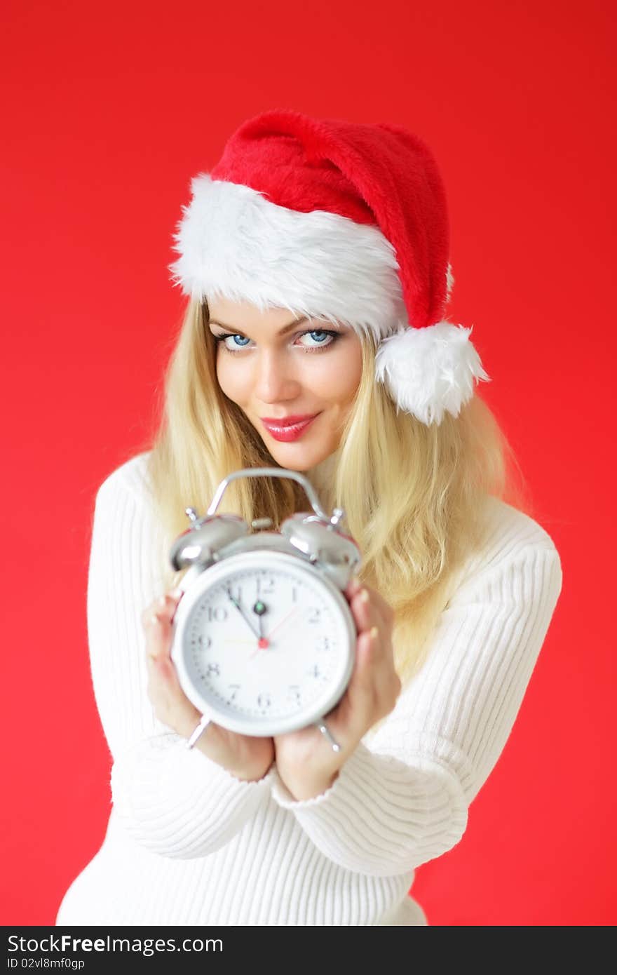 Attractive girl holding alarm clock. Attractive girl holding alarm clock