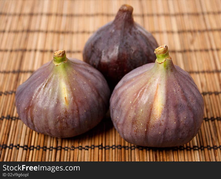 Ripe figs on rural background