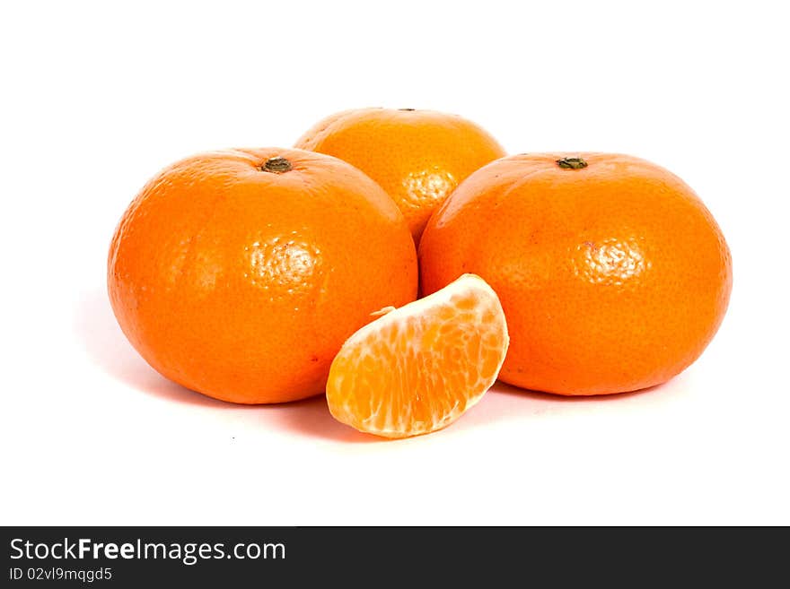 Ripe mandarin and half isolated on white background