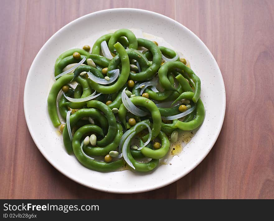 Fresh green bean salad with onion and vinegar close up