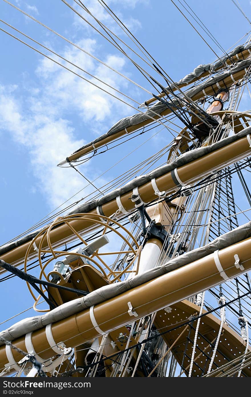 Masts of a tall Ship and cloudy blue sky. Masts of a tall Ship and cloudy blue sky