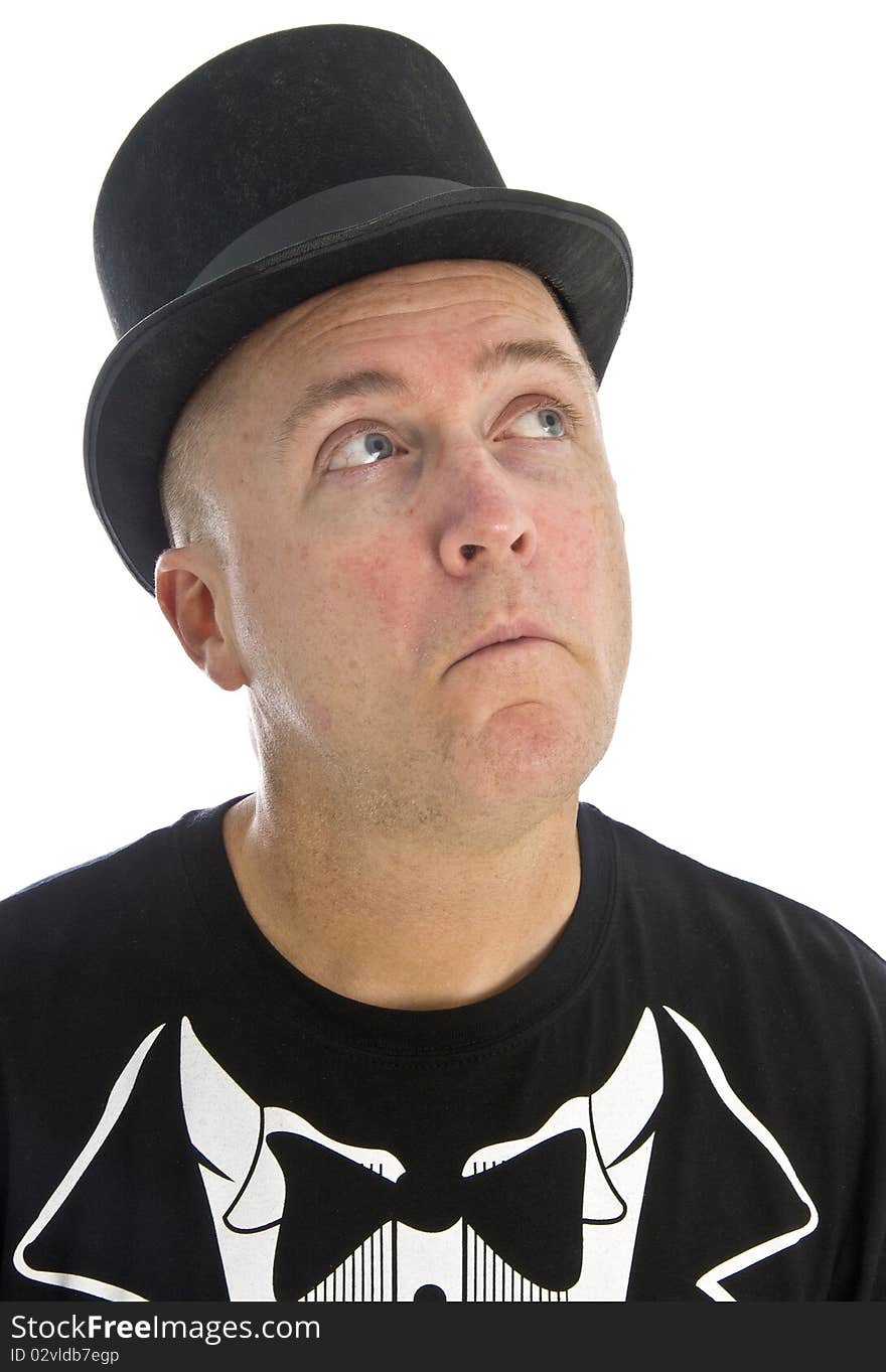 A Caucasian man wearing a black T-shirt and Hat looking up, isolated on white. A Caucasian man wearing a black T-shirt and Hat looking up, isolated on white.