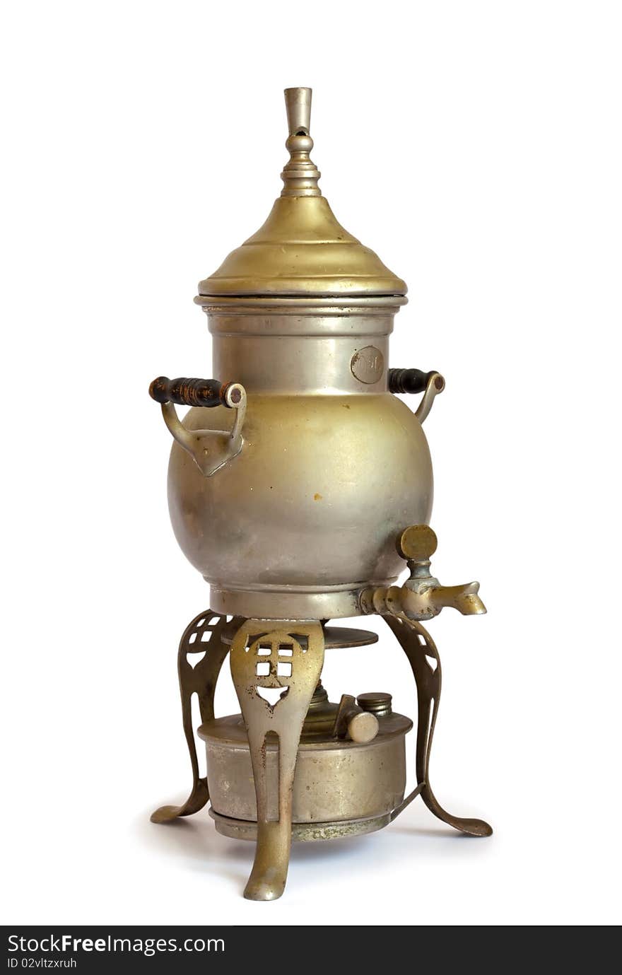 Antique coffeepot with spirit lamp isolated on a white background