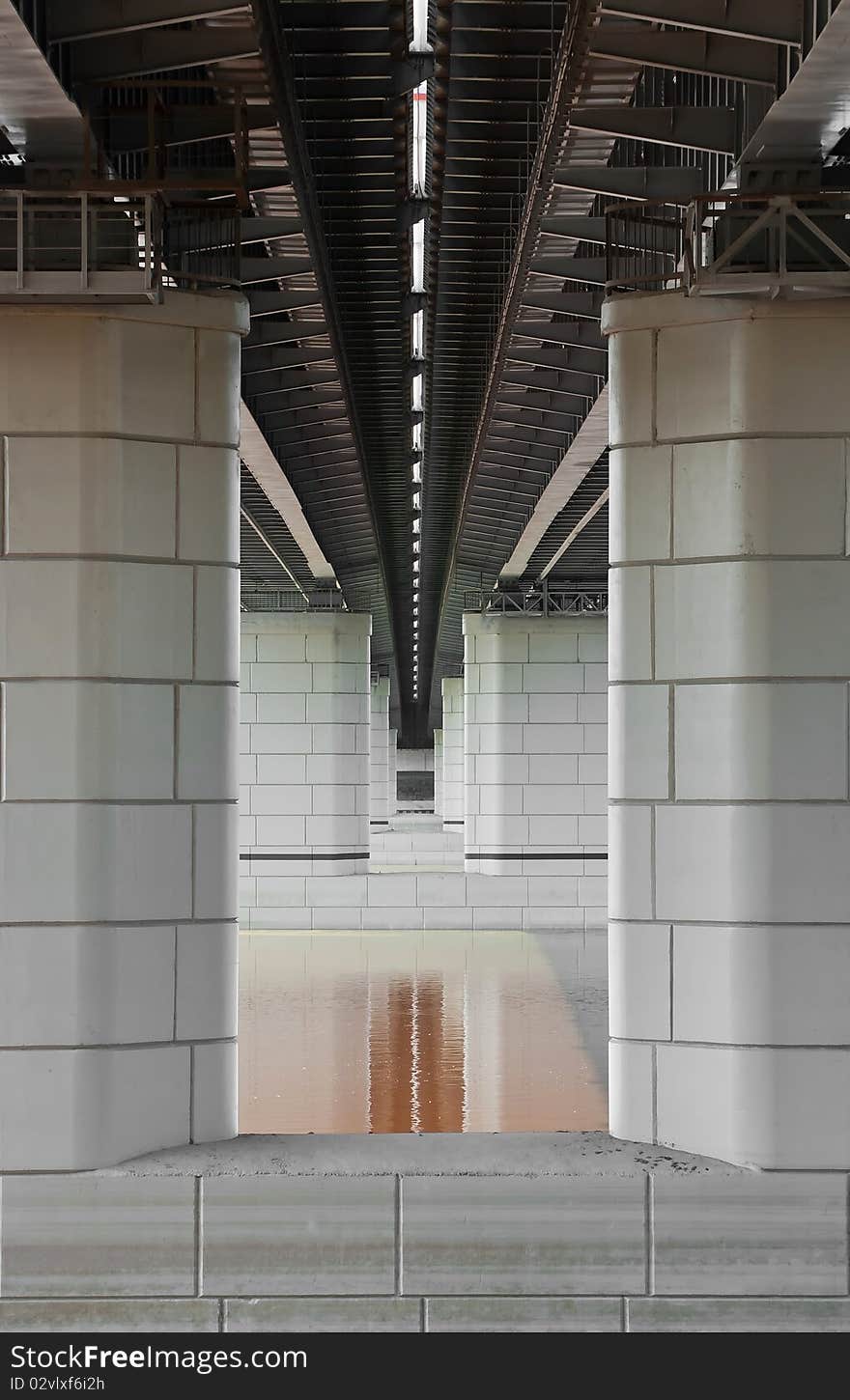 Bridge pillars of gray block over water