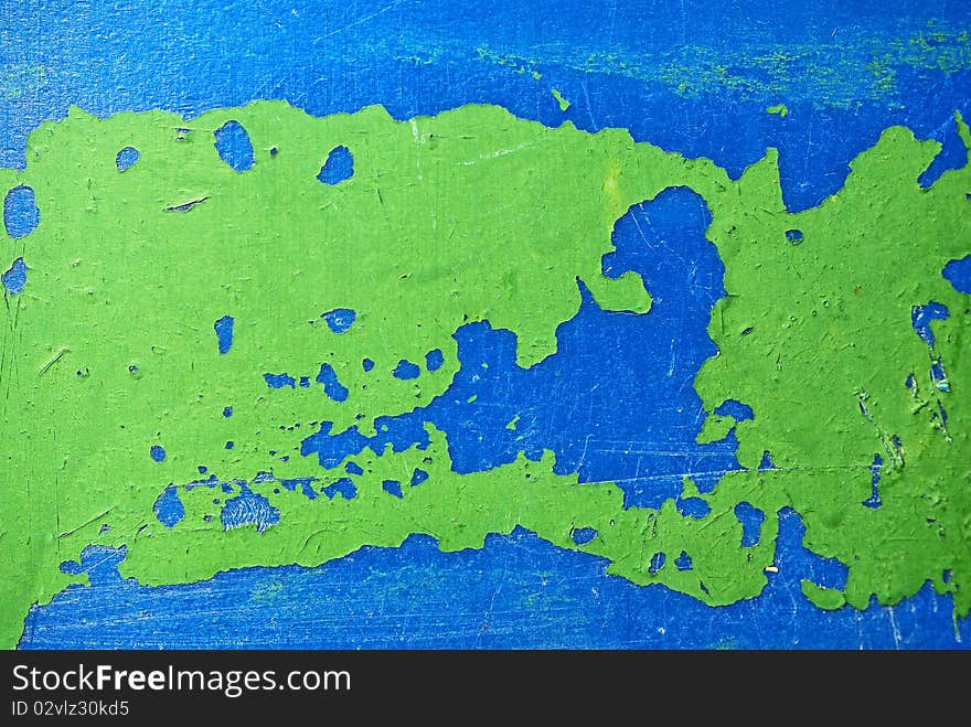 Remnants Of Green  Paint On Blue Plastic Surface