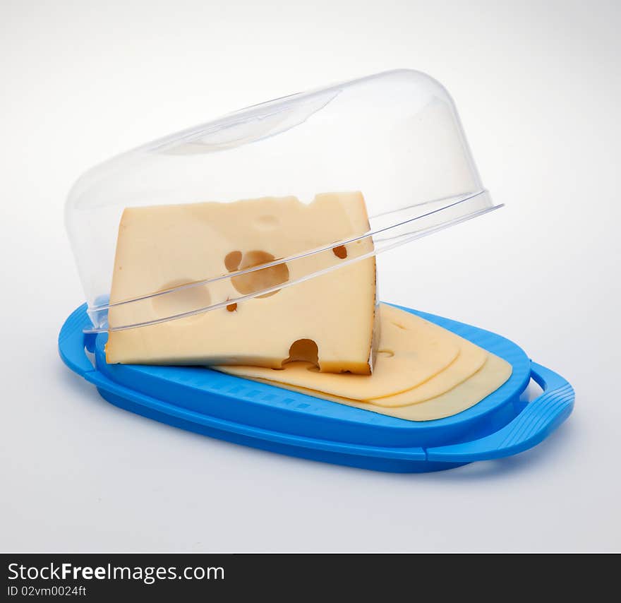 Cheese in the butterdish on white background. Cheese in the butterdish on white background