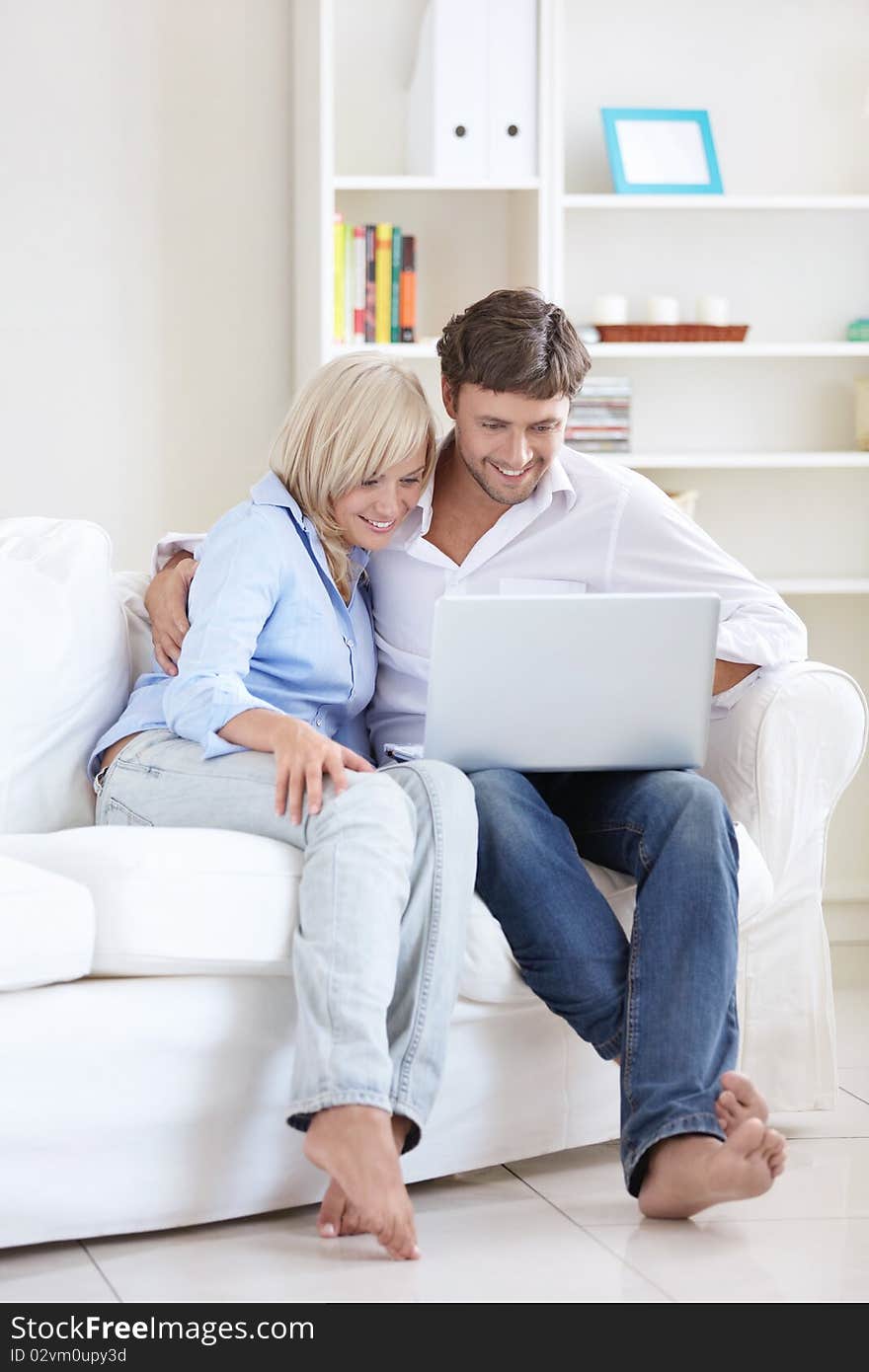 Mature happy couple with laptop at home. Mature happy couple with laptop at home