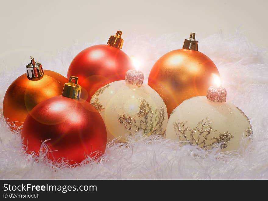 Christmas white candles and red spheres