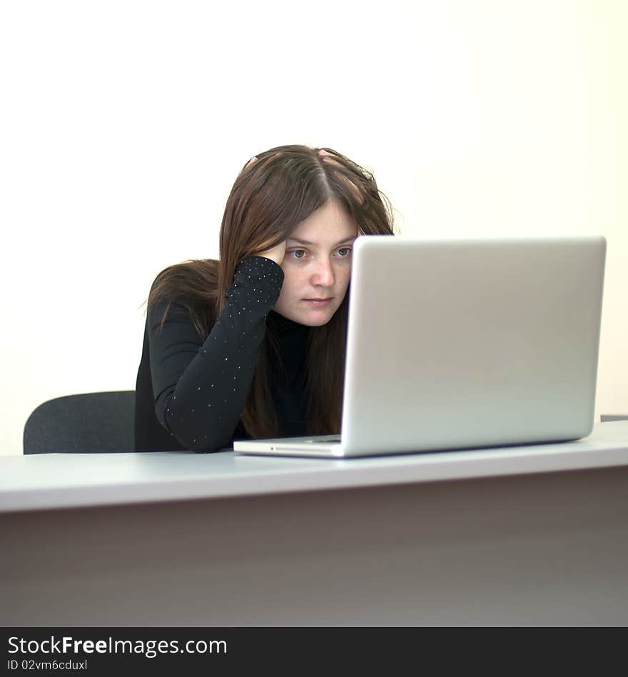 Young business woman work on laptop in office