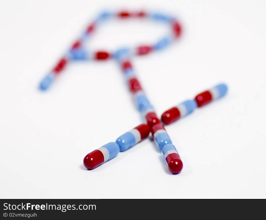 Close-up image of medical pills against plain background. Close-up image of medical pills against plain background