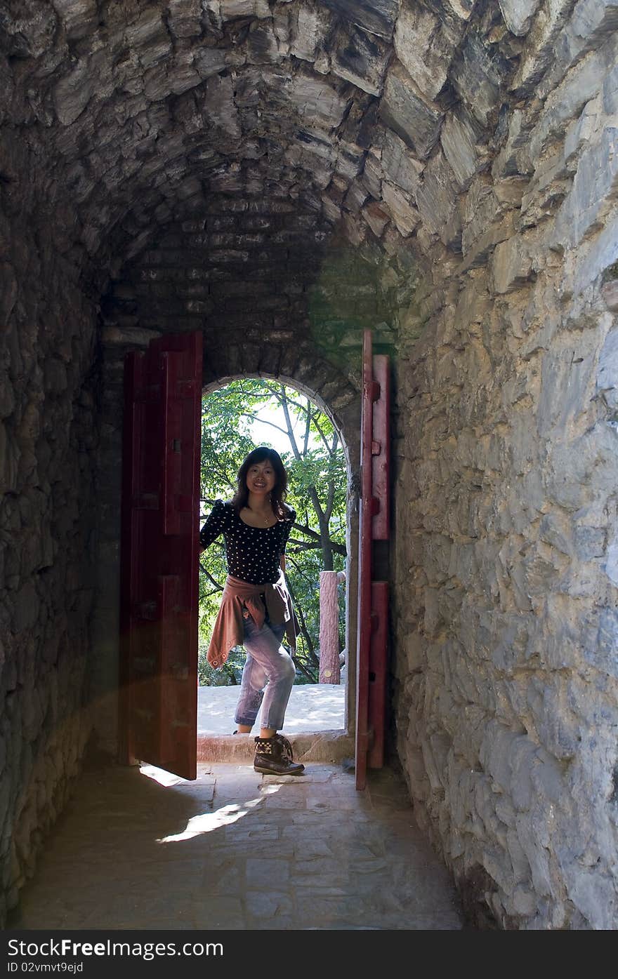 The silhouette of a woman find a grotto door. The silhouette of a woman find a grotto door