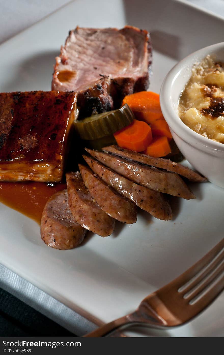 Trio of pork with macaroni and cheese