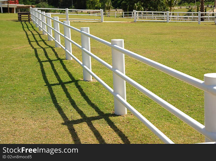 White fence in the hill