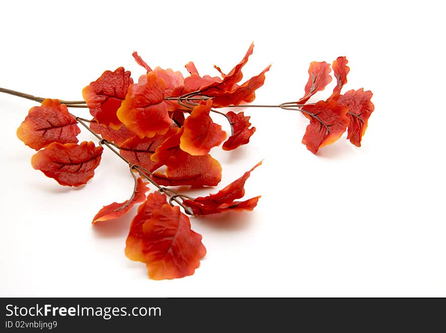 Artificial branch with red leaves