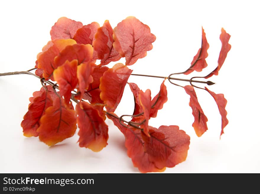 Artificial branch with red leaves