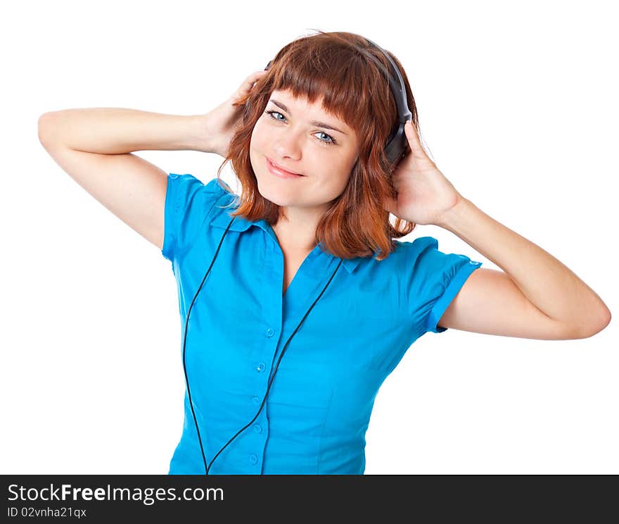 Young red-haired girl listen to music and dance. Isolated on white background