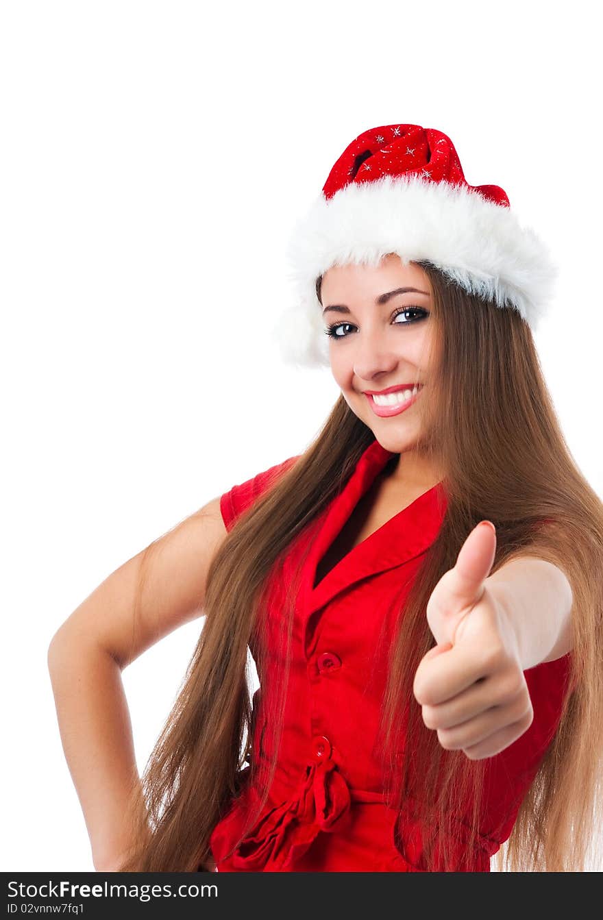 Attractive young women in santa claus hat show the thumb. Attractive young women in santa claus hat show the thumb