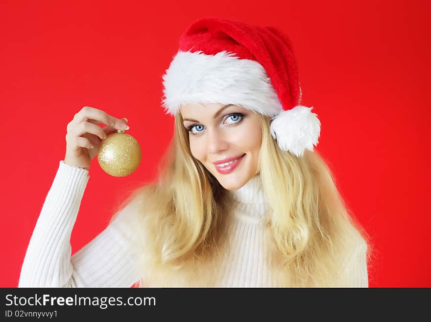Attractive girl holding a Christmas ball