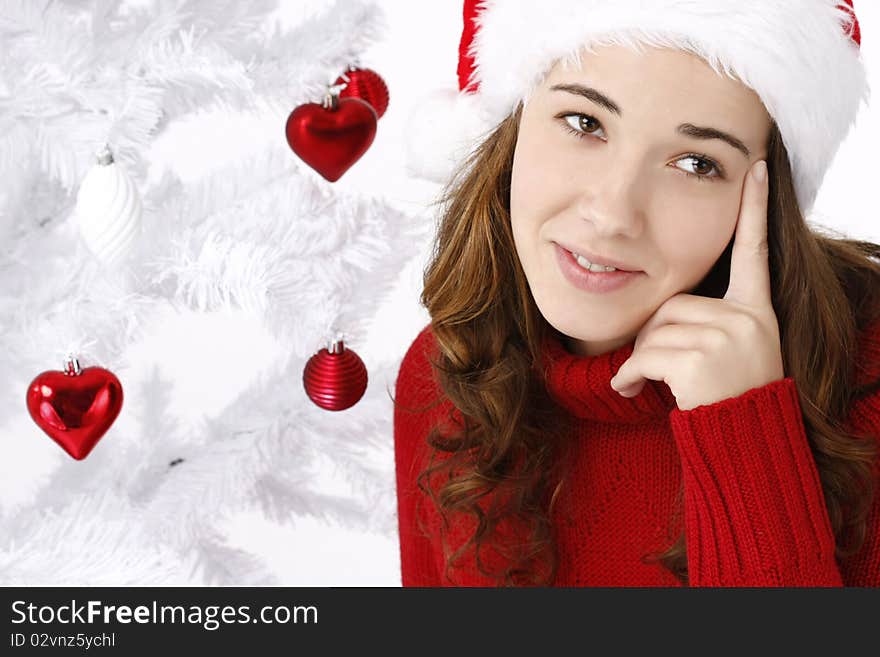 Beautiful Young Woman Next To Christmas Tree