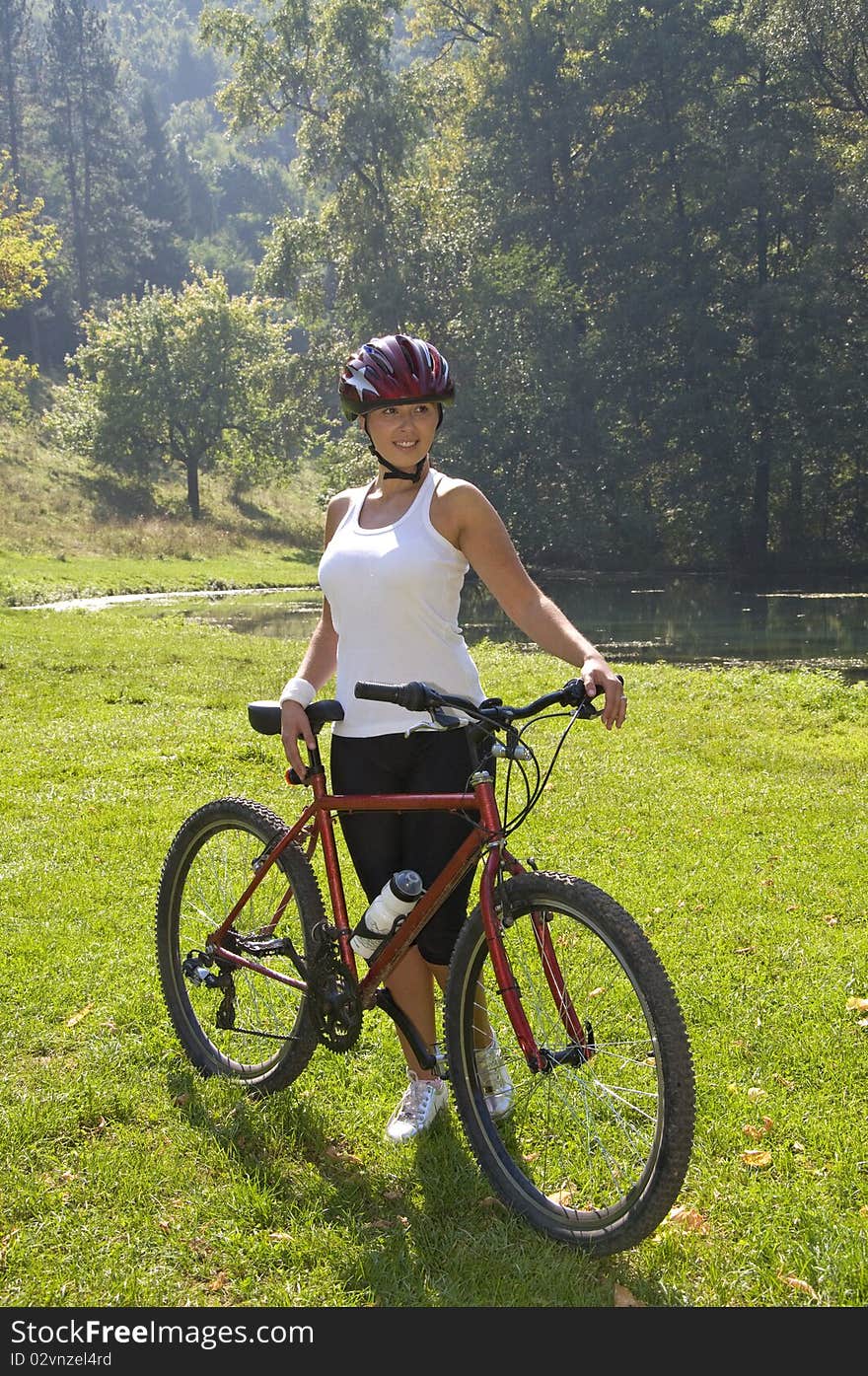 Cute girl is driving a bike