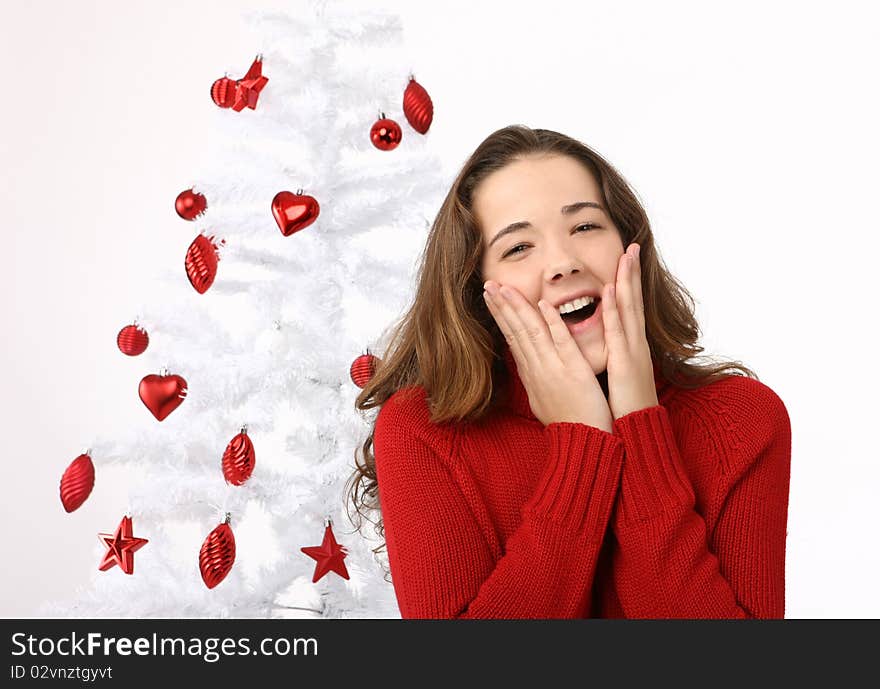 Beautiful Young Woman Next To Christmas Tree