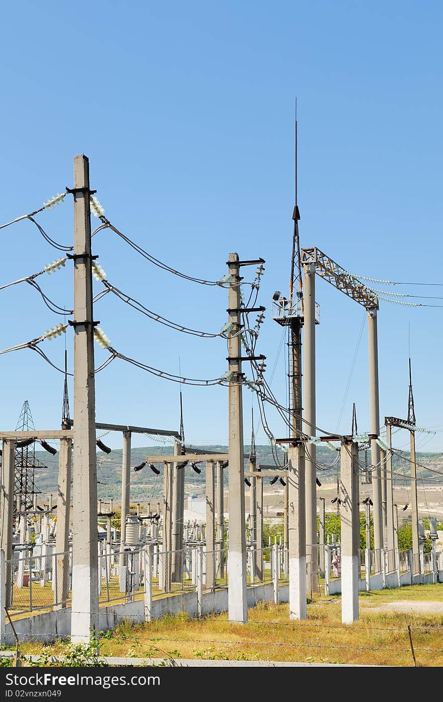 Power lines against the blue sky