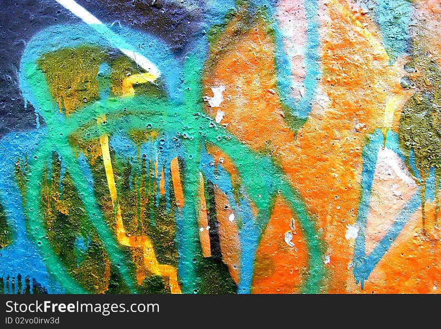 Detail of graffiti on a wall ideal for urban or grunge background. Detail of graffiti on a wall ideal for urban or grunge background