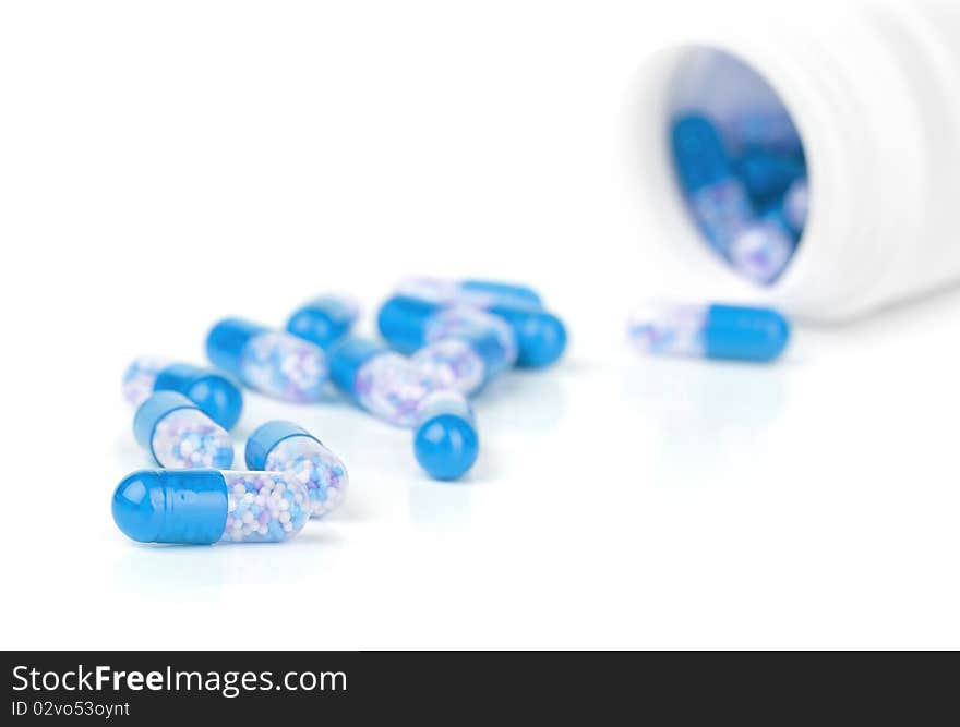 Closeup blue pills isolated on a white background