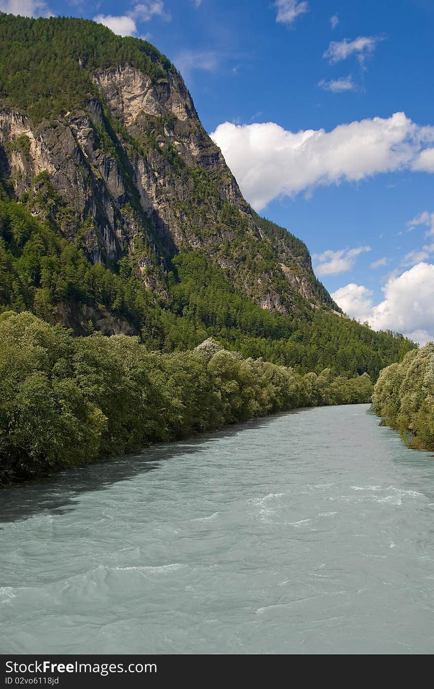 Drava river landscape. Mountains, sky and clouds on background