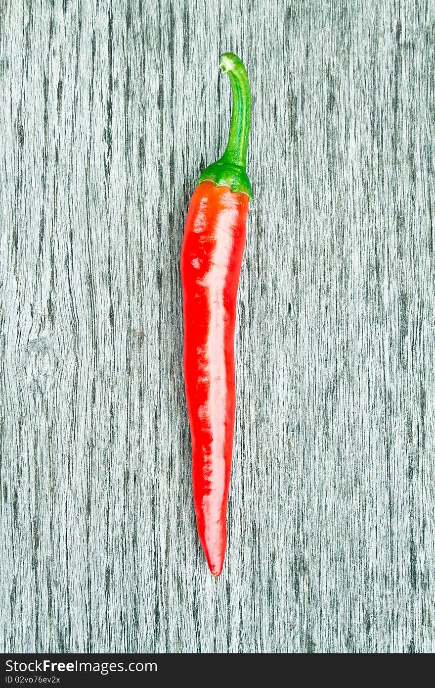 Red chilli pepper on a cutting board