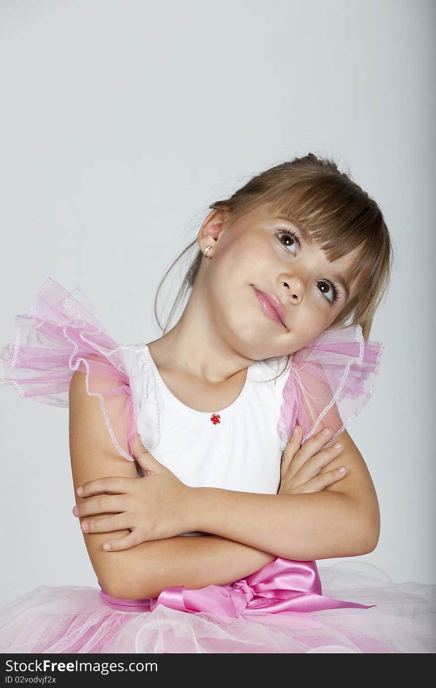 Portrait of a beautiful little ballerina looking sideways, studio image. Portrait of a beautiful little ballerina looking sideways, studio image