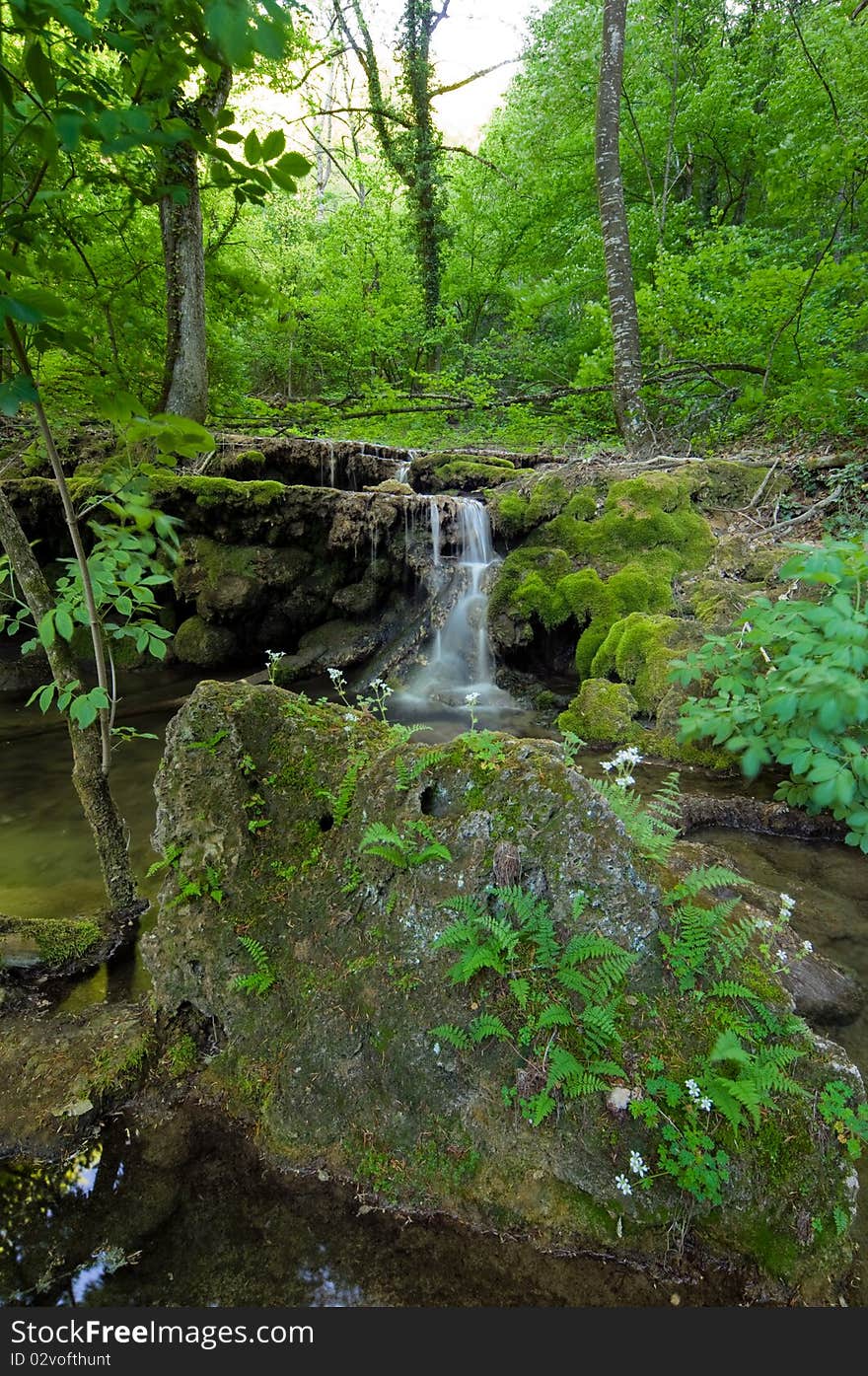 Waterfall In Mountains