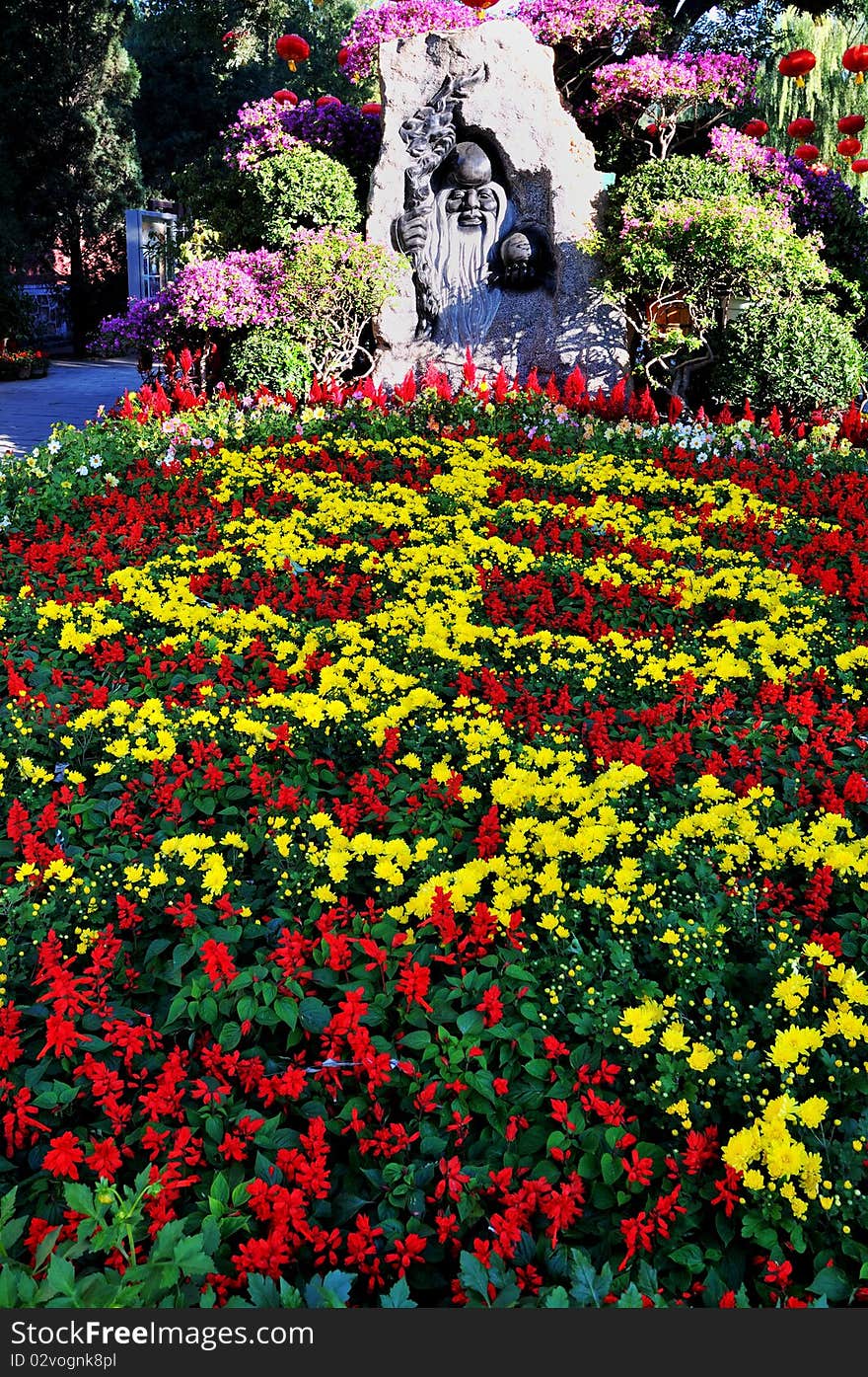 Statue of long-lived people in flowers. Statue of long-lived people in flowers.