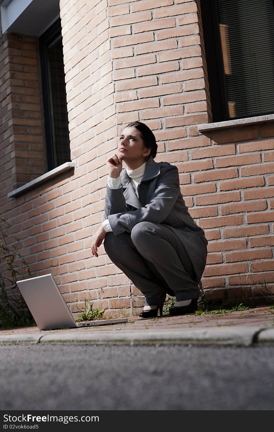 Young business woman with notebook, outdoors