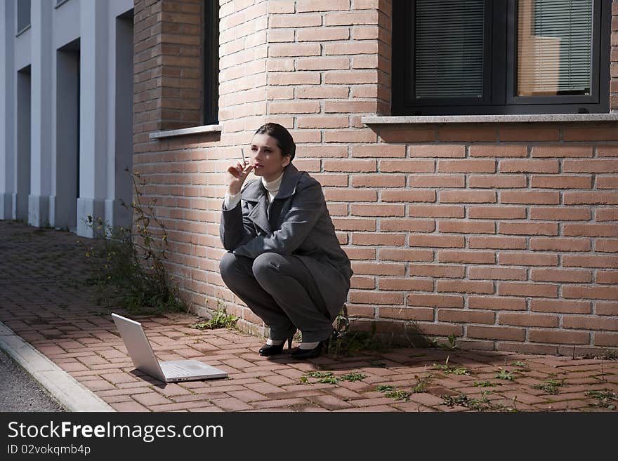 Young Business Woman With Cigarette And Notebook