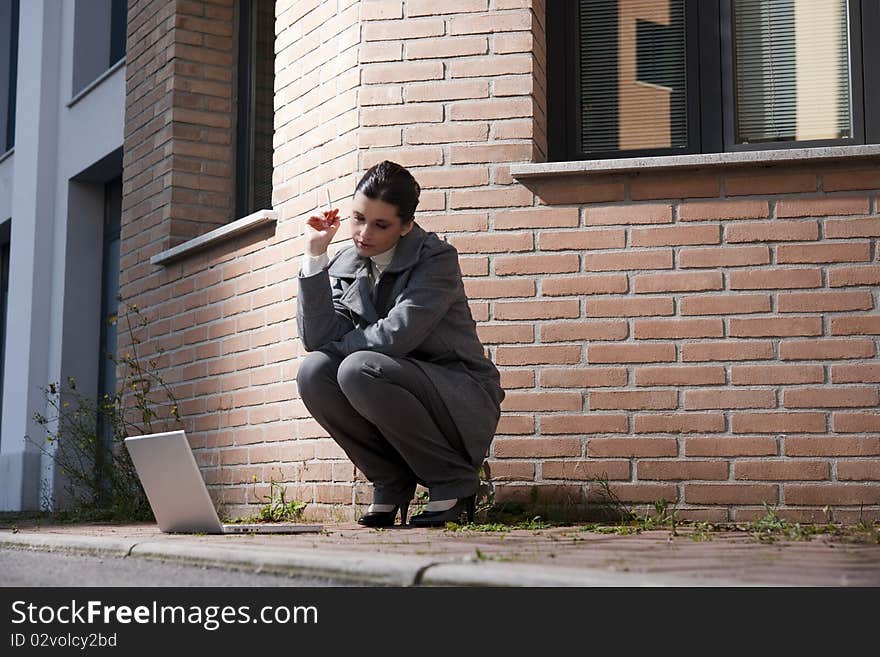 Young Business Woman With Cigarette And Notebook