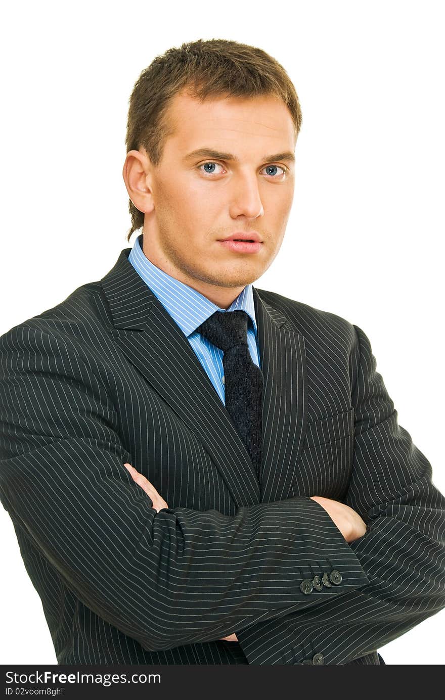 Assured young businessman in reflection on white background