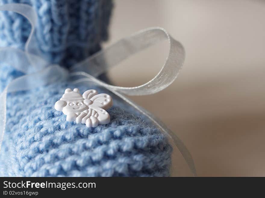 Closeup of blue baby's bootee