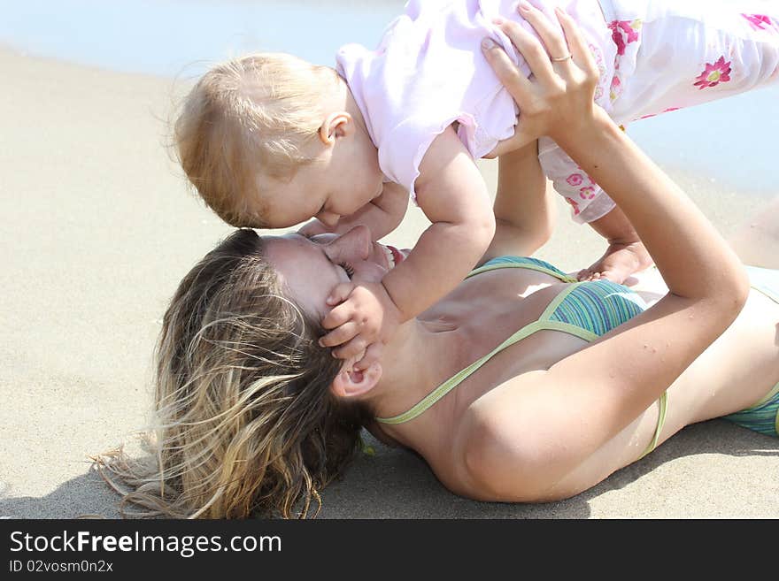 Mother and daughter in the sand