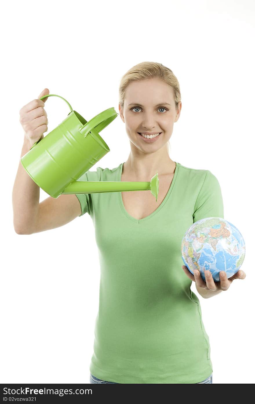 Young woman watering the Earth; conepts: lack of water, giving life, saving