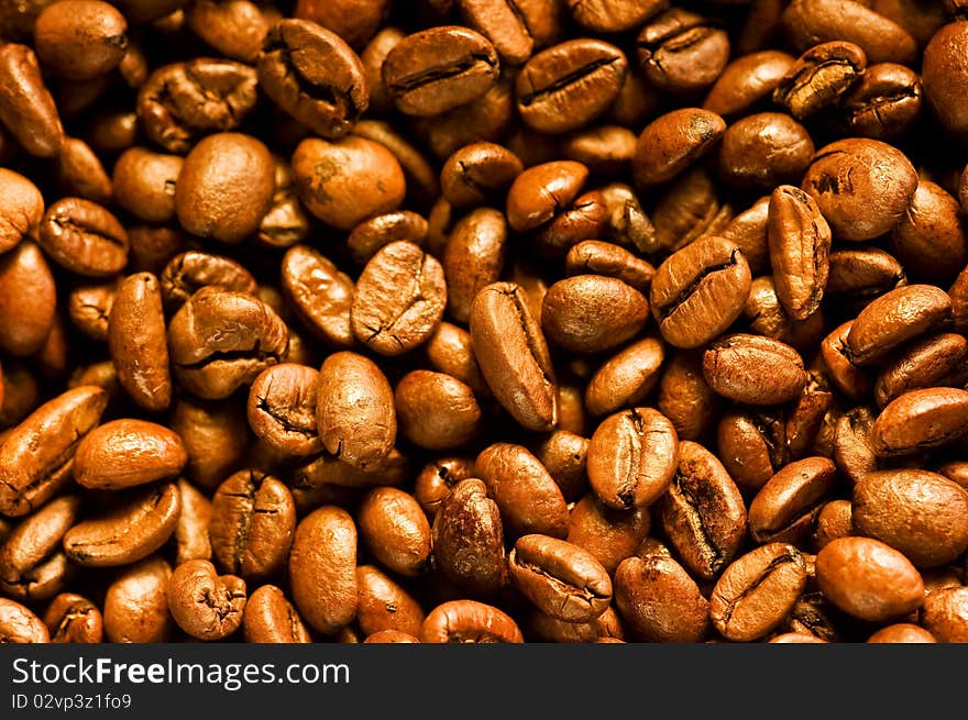 A lot of brown good smelling coffeebeans. A lot of brown good smelling coffeebeans