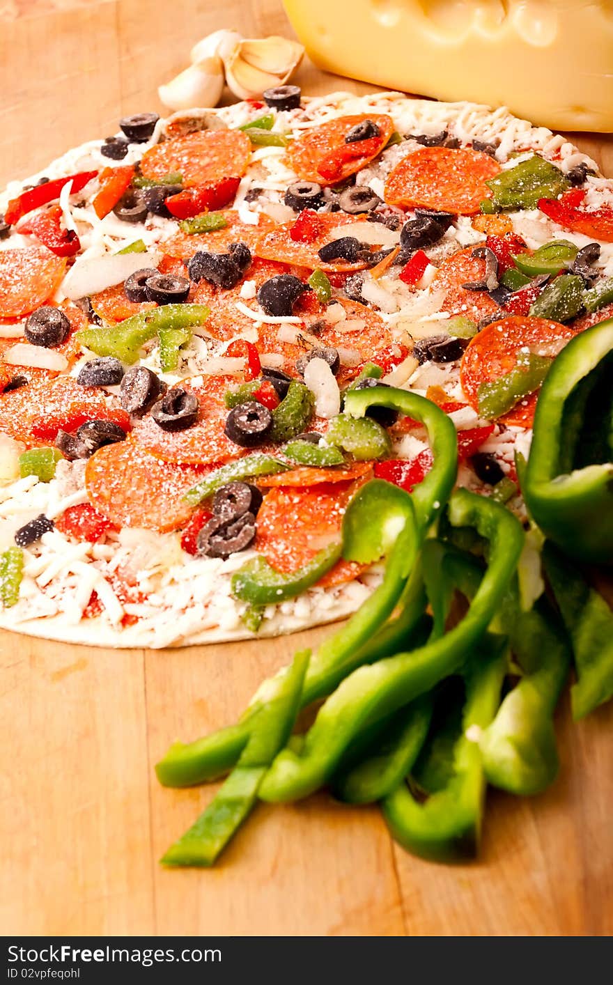 Raw Pizza With Vegetables And Pepperoni