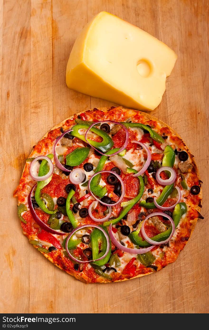 Pizza with vegetables and pepperoni