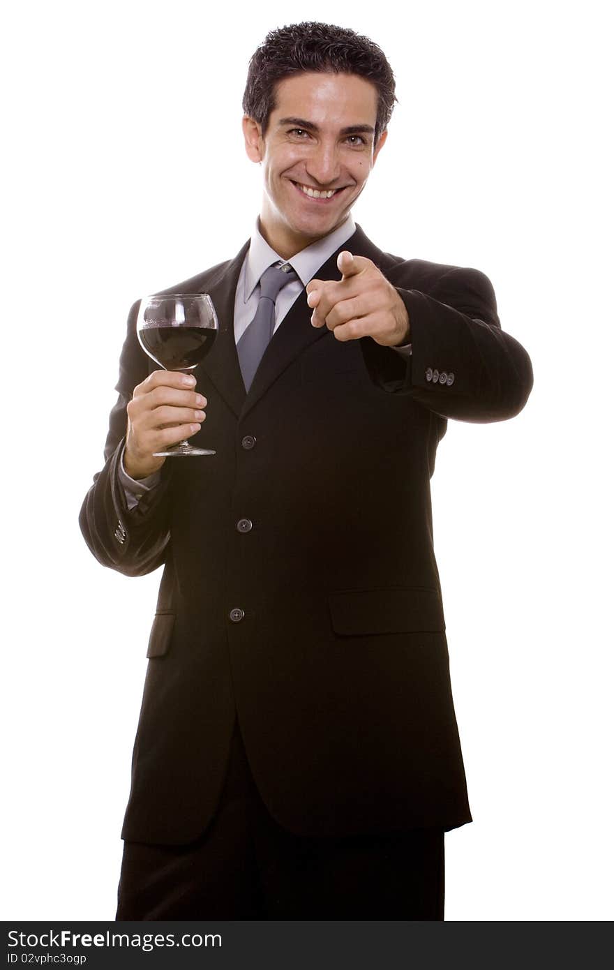 Businessman in suit celebrating his success with a glass of wine. Businessman in suit celebrating his success with a glass of wine