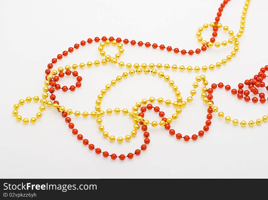 Christmas red and gold beads close-up. Christmas red and gold beads close-up