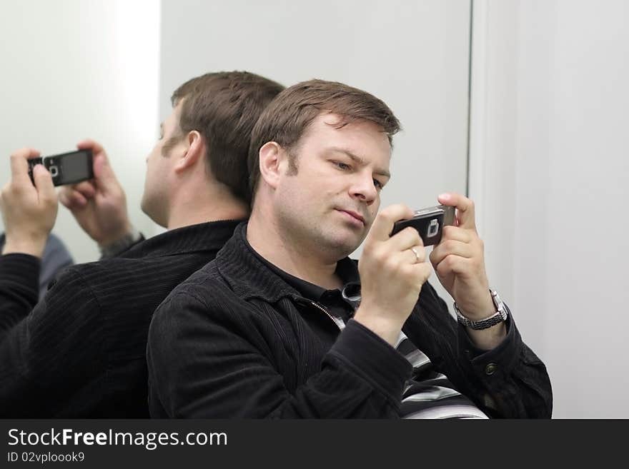 A young man with mobile phone. A young man with mobile phone