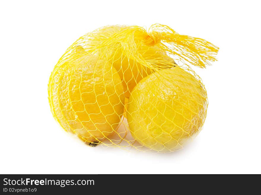 A yellow bunch of three lemons isolated over white